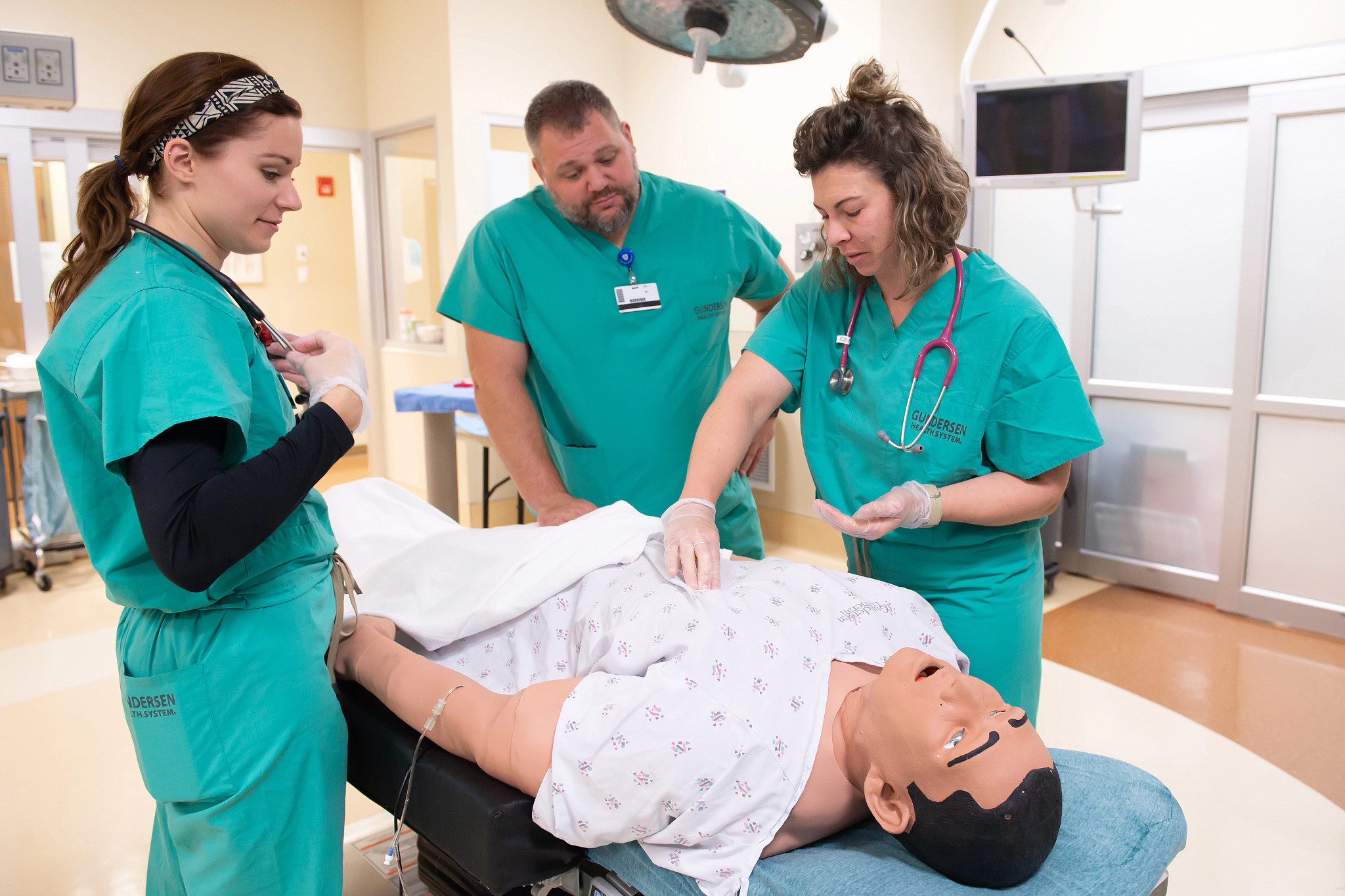 Emergency Medicine Physician Assistant fellows training in simulation lab.