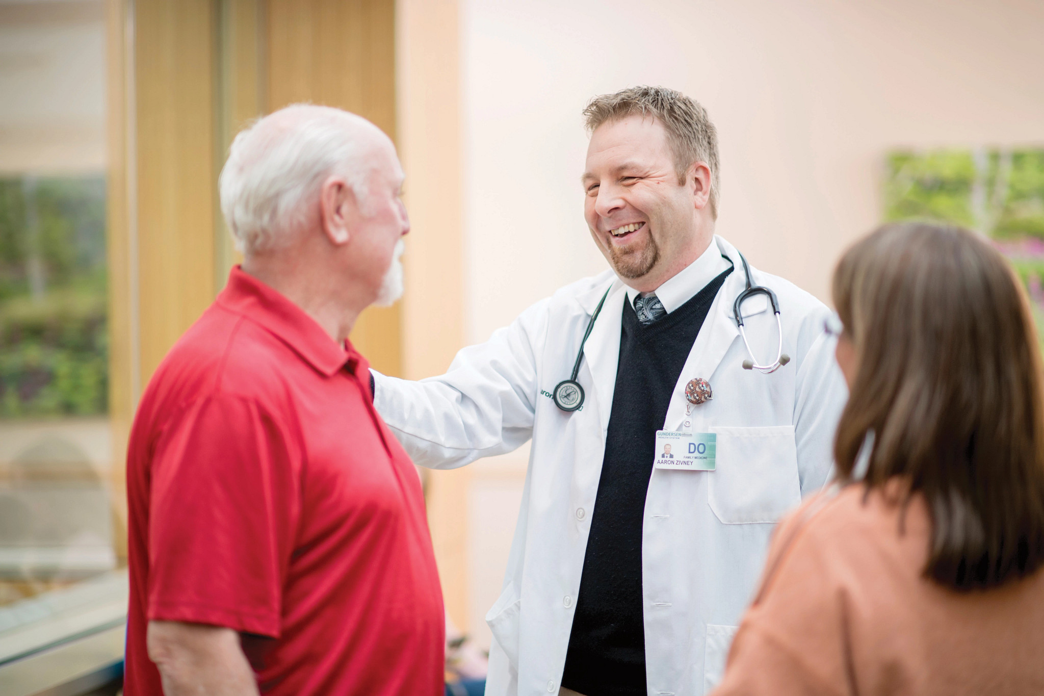 physician-smiling-at-patient-with-hand-on-patients-shoulder.jpg