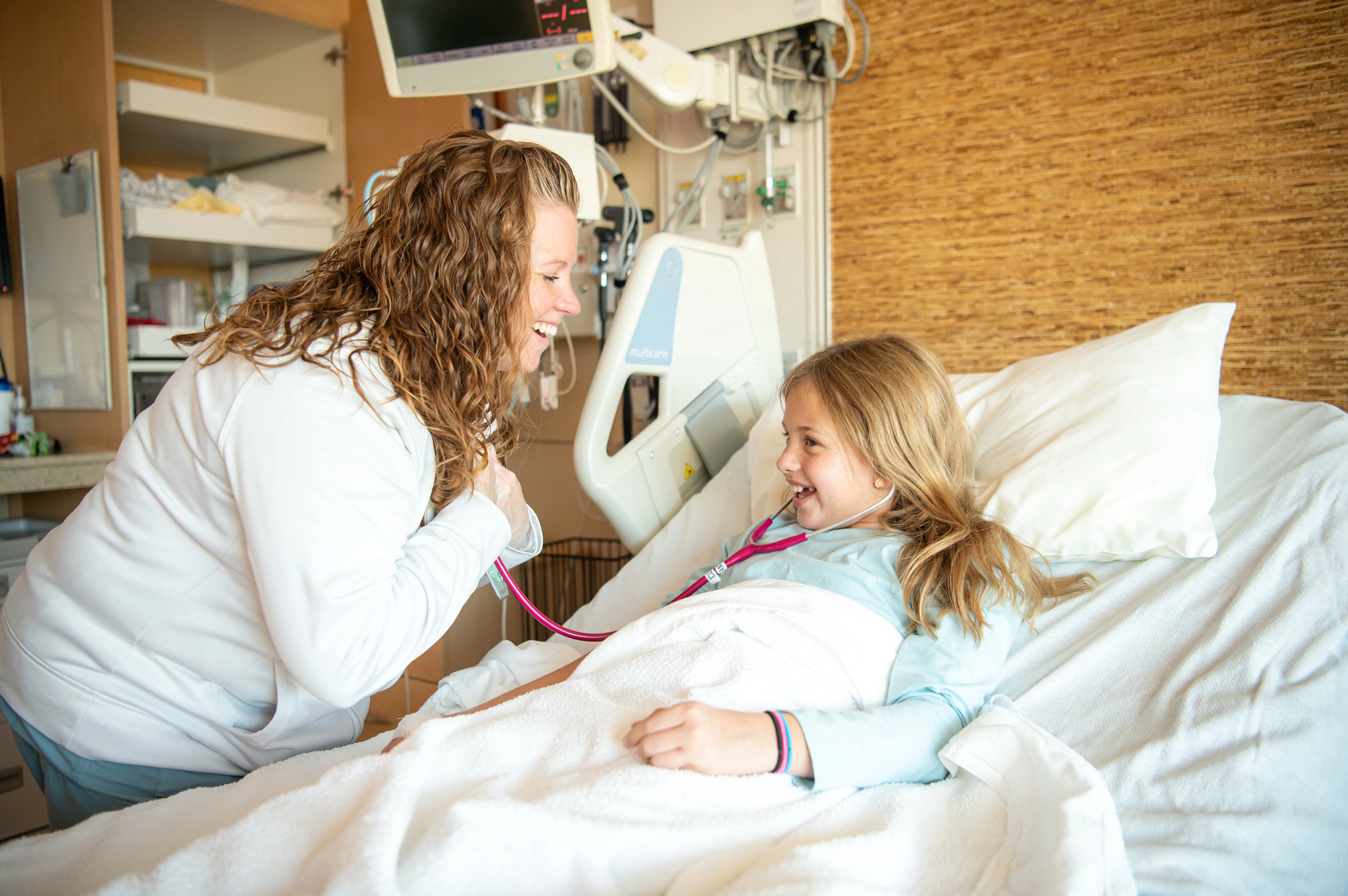 RN-laughing-with-child-in-hospital