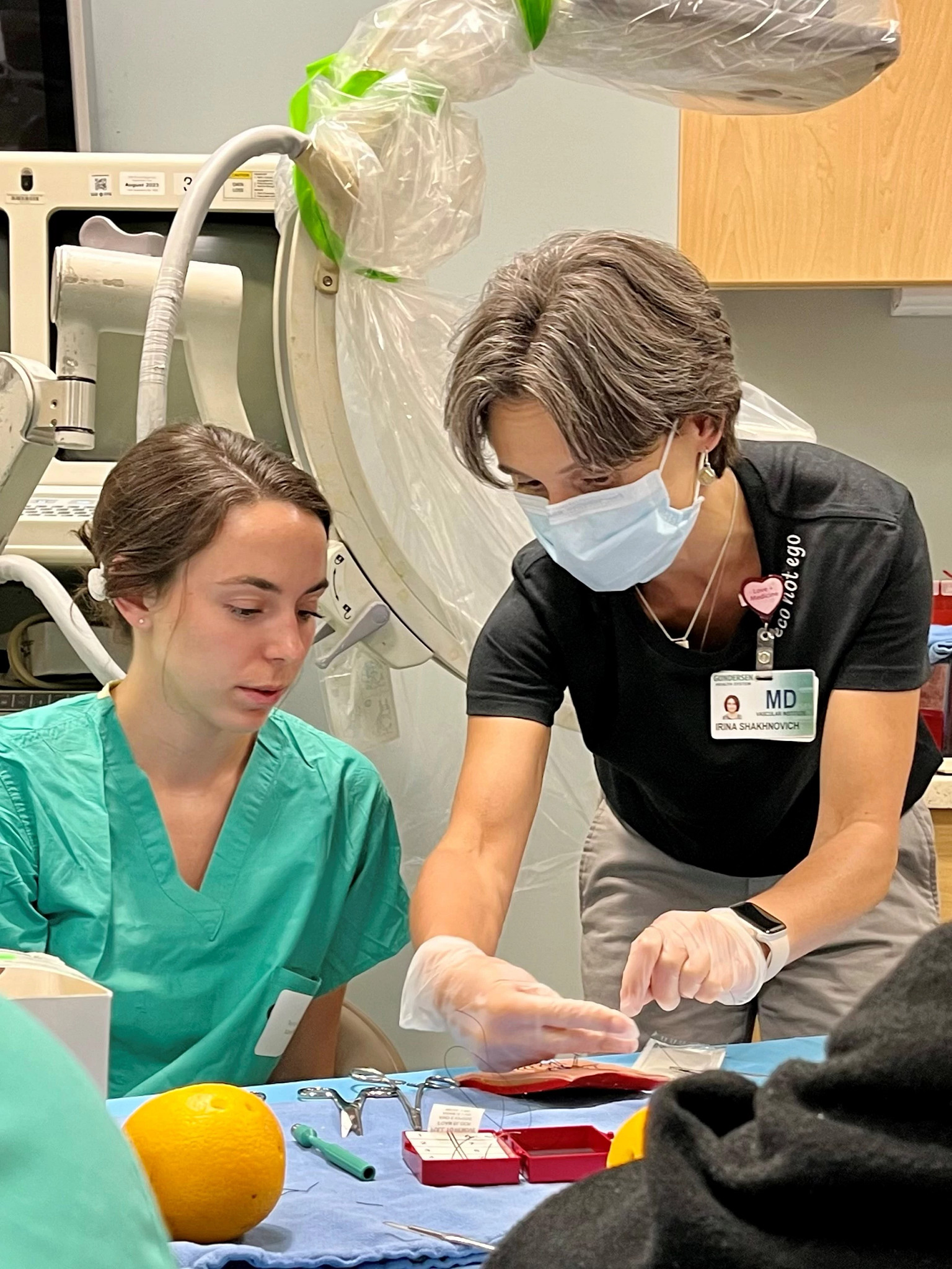 Medical student with doctor in skills lab.