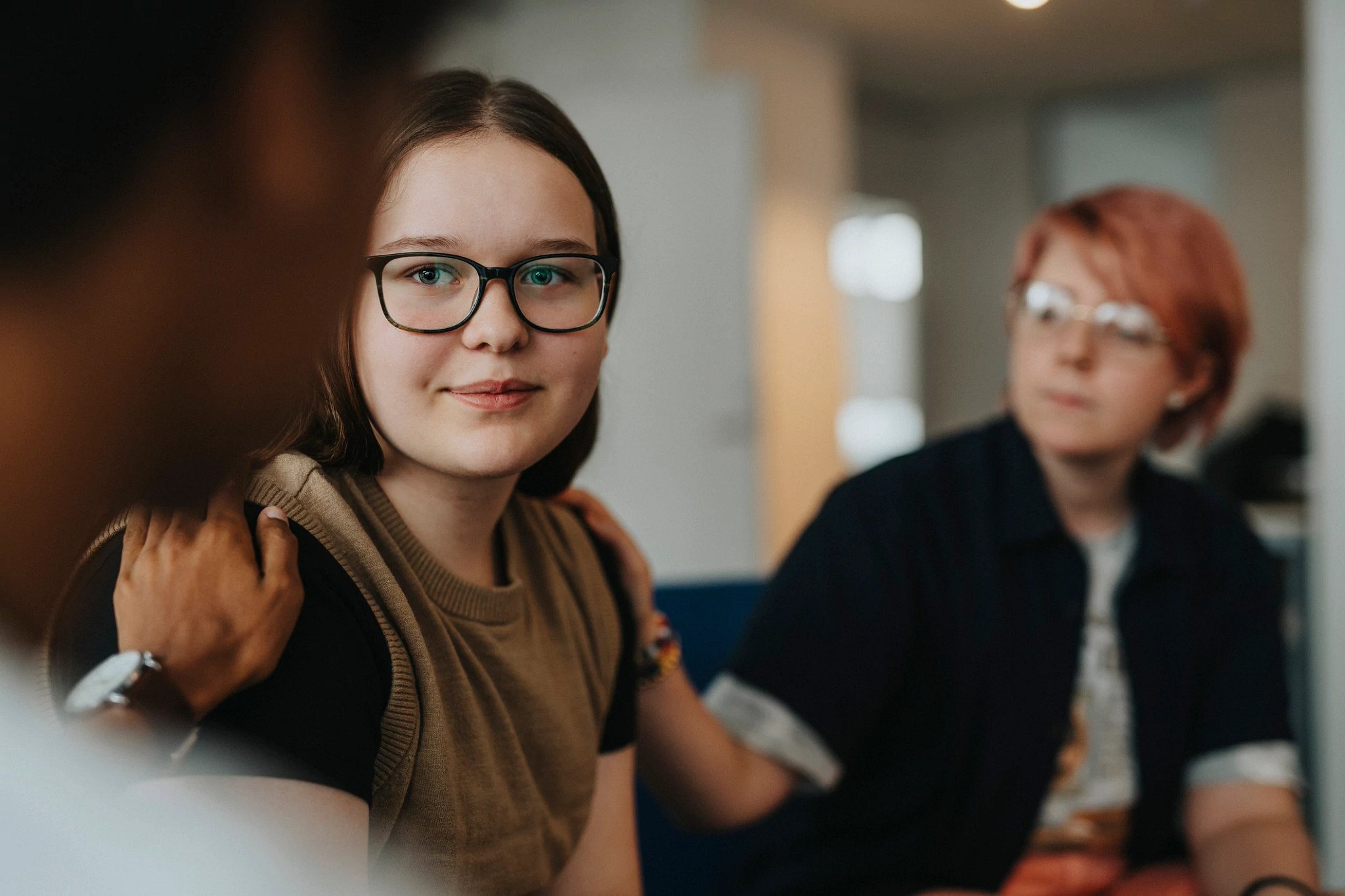 Teen girl sharing in group therapy.