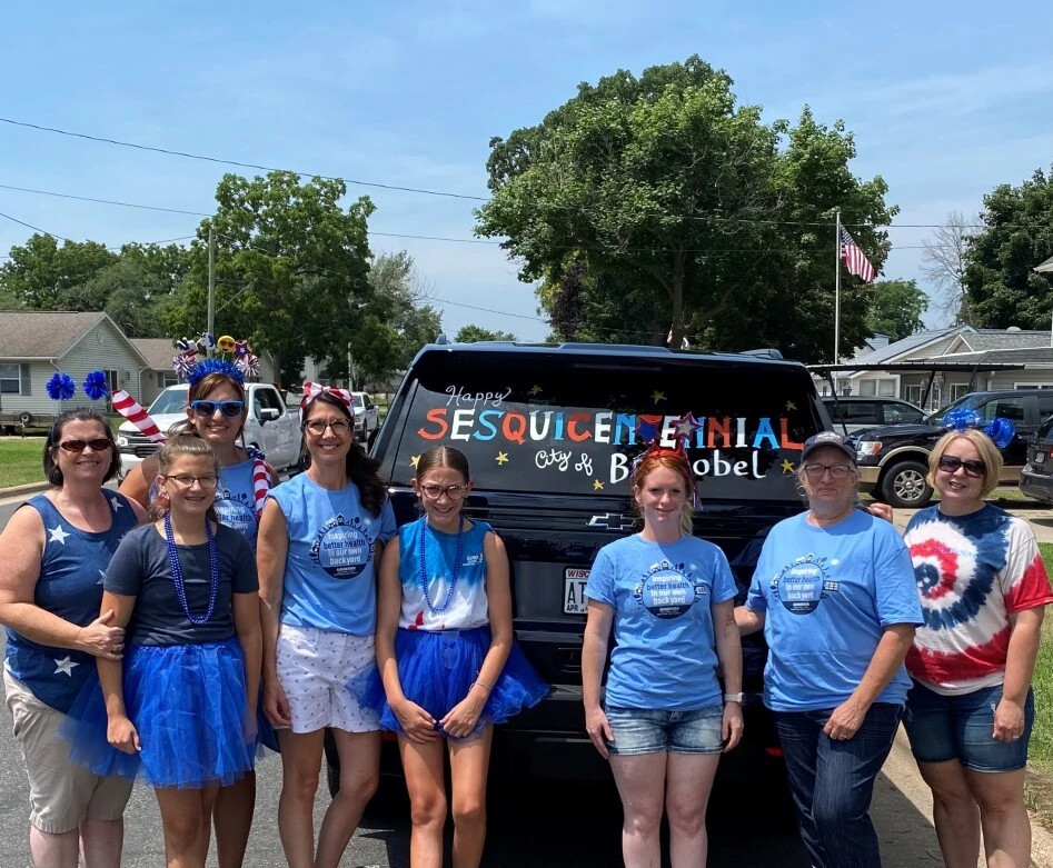 Boscobel colleagues smiling at community parade.