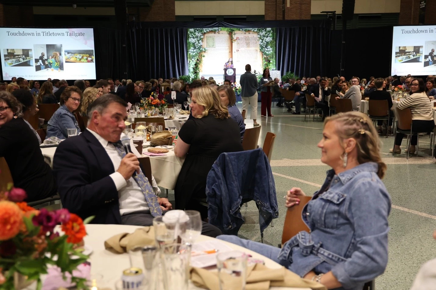 Bill Jartz speaking with a member of the crowd at Black Tie & Blue Jean Extravaganza