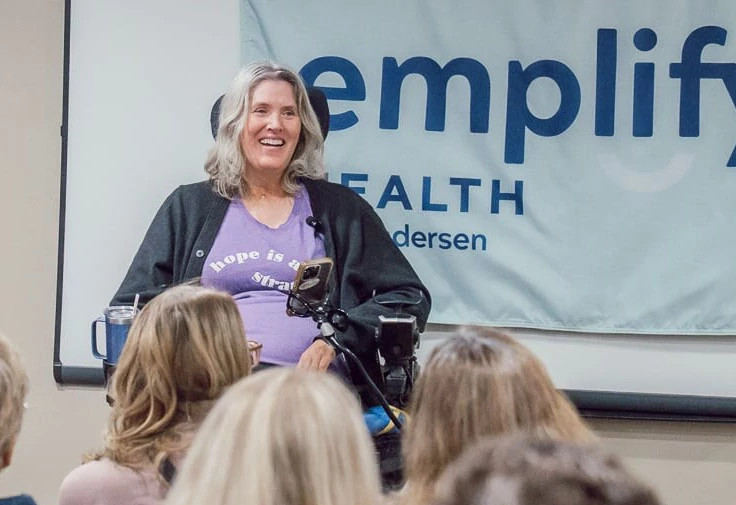 Sarah shares spinal injury story at Physical Therapy Month event in West Union.