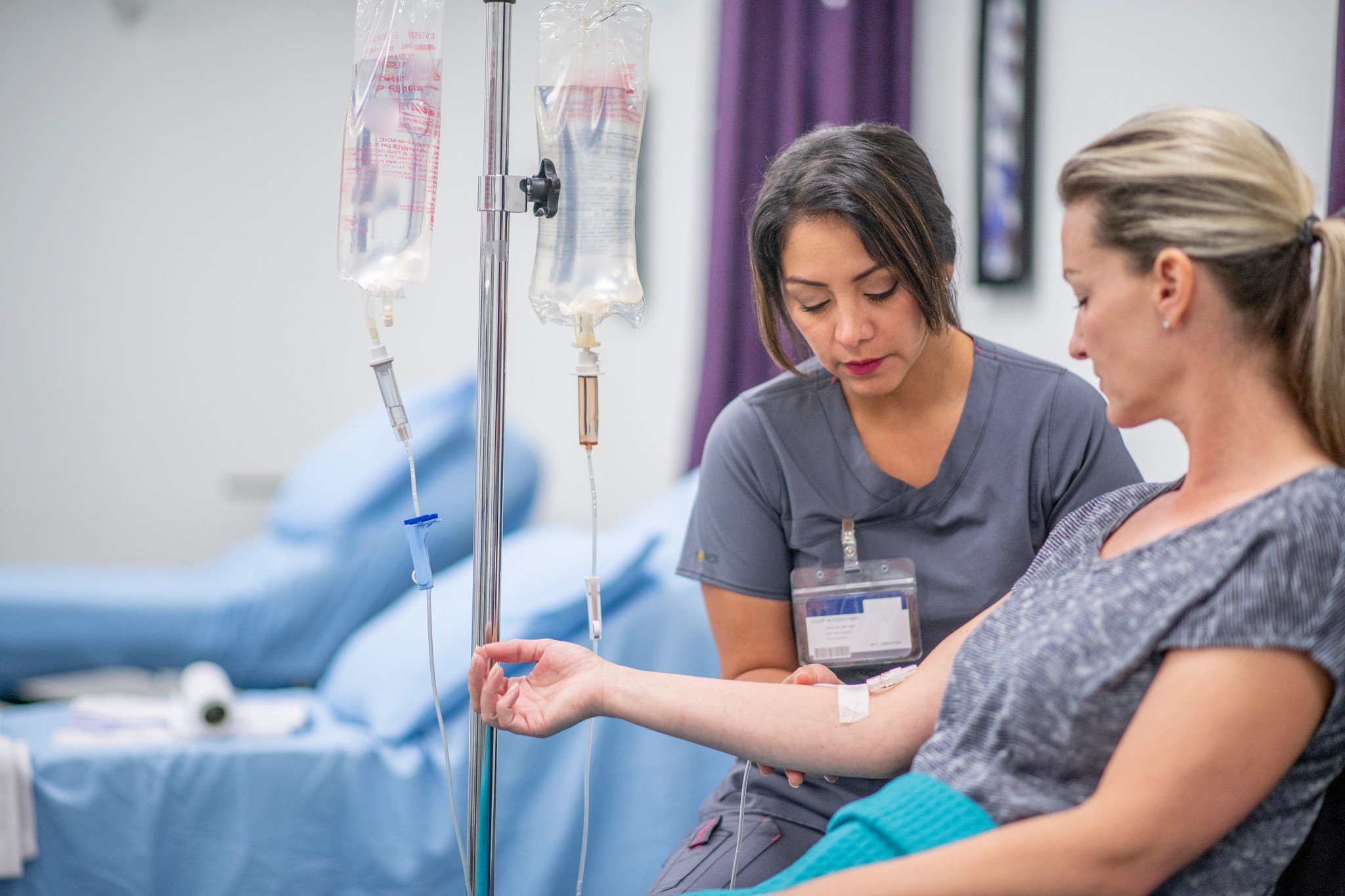 Women receives IV drip treatment