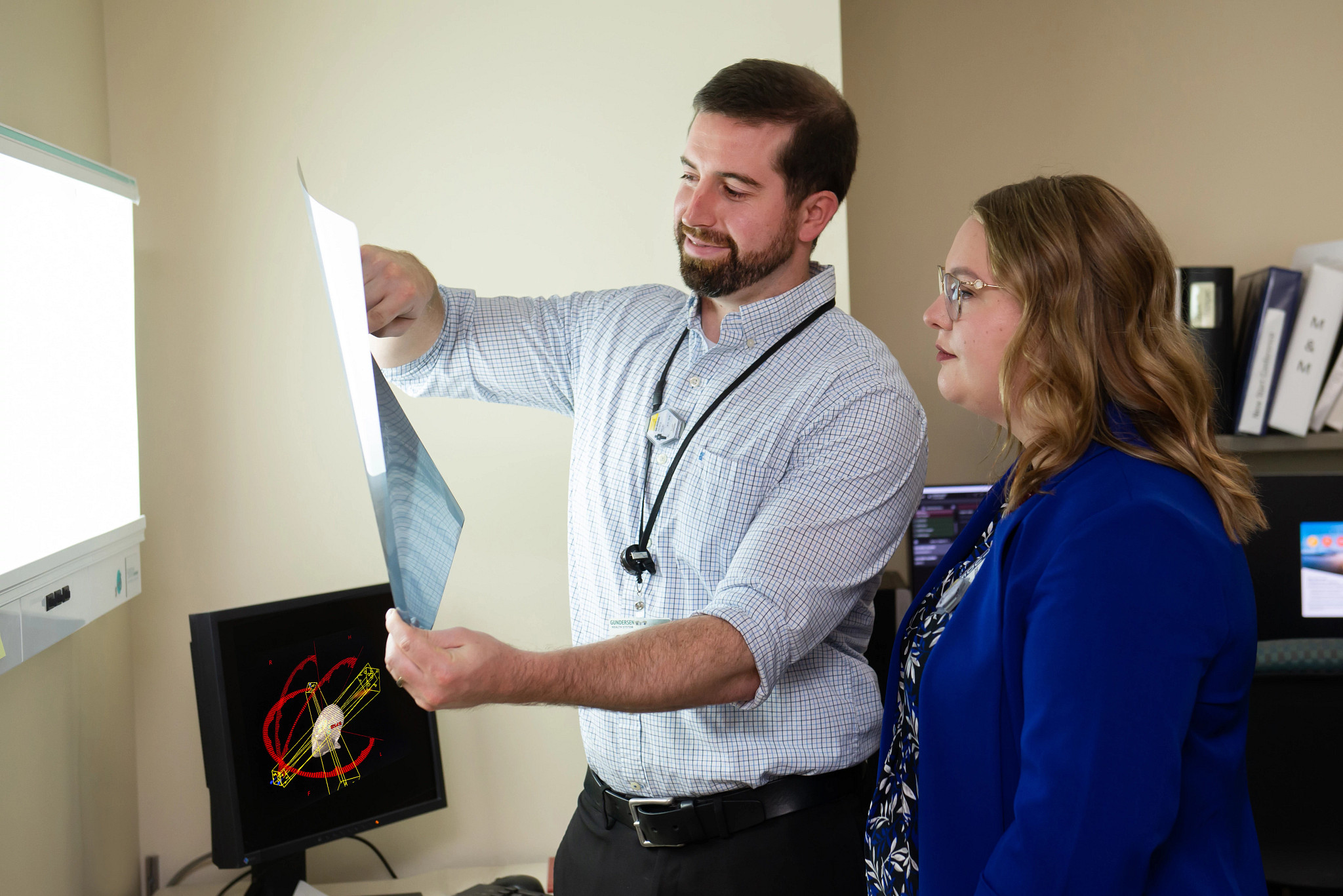 dosimetrist-explaining-medical-imaging-to-student.jpg