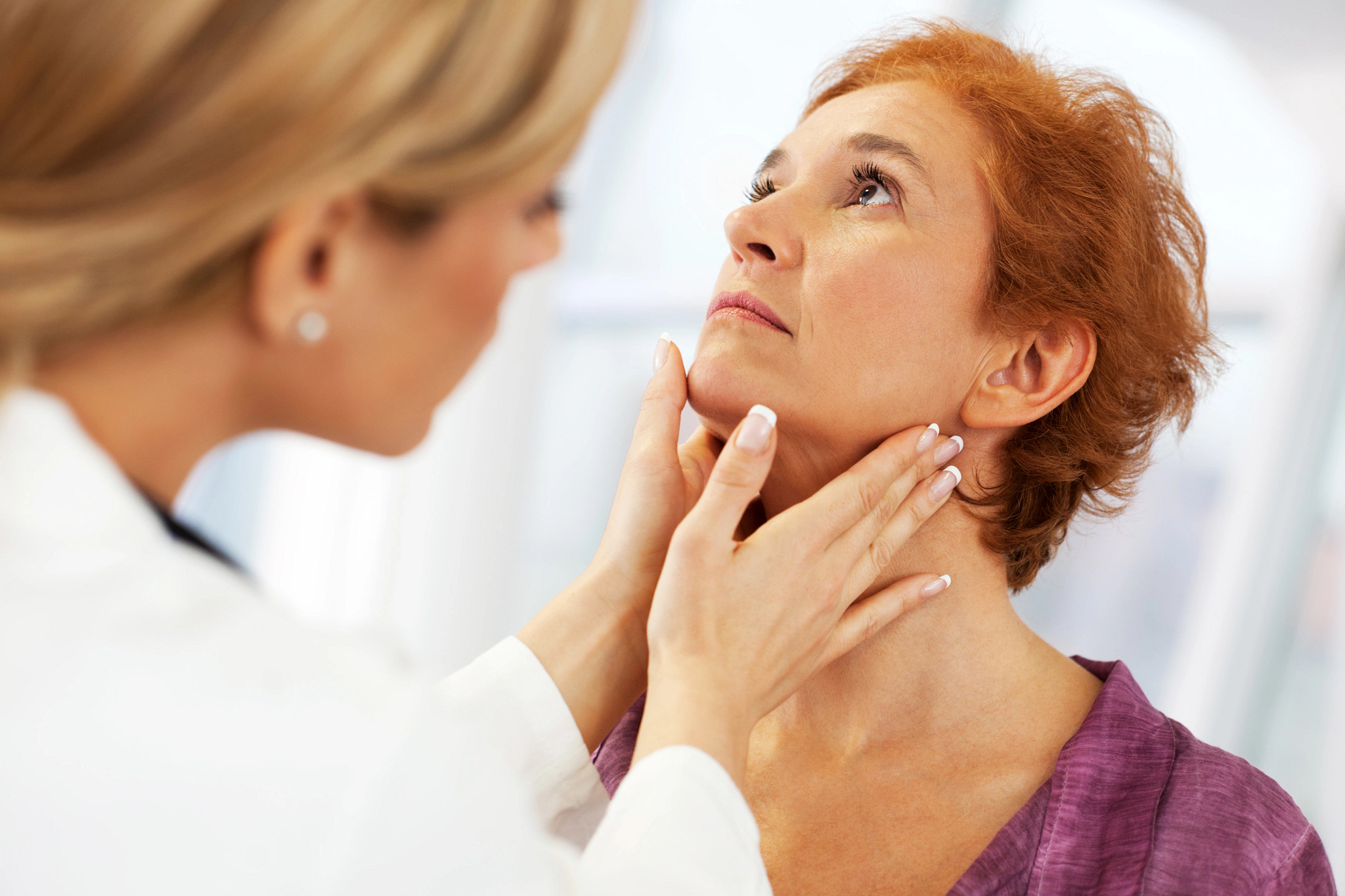 Female doctor examining her patient