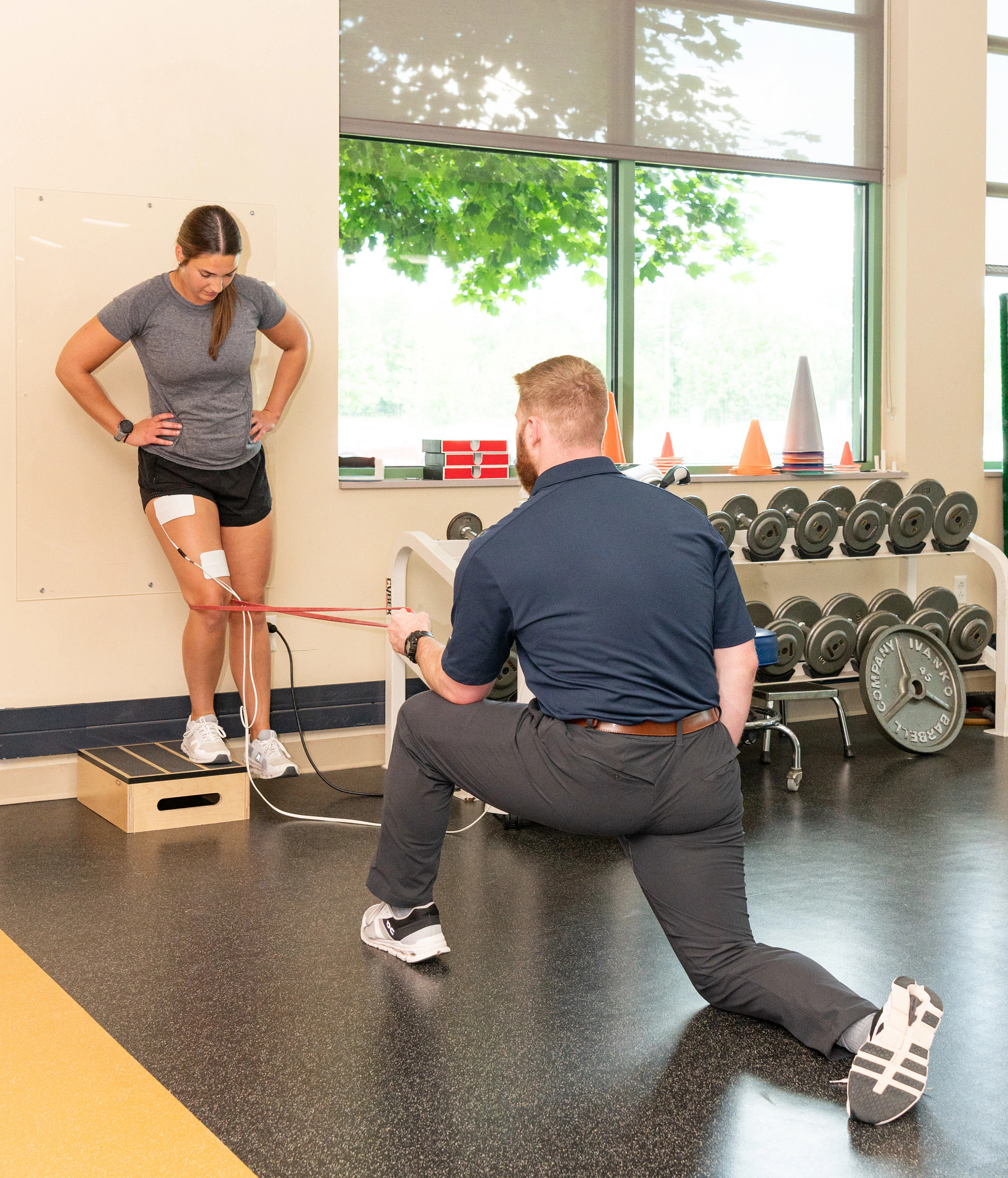 Physical therapist assessing athlete in Gundersen sports physical therapy gym.
