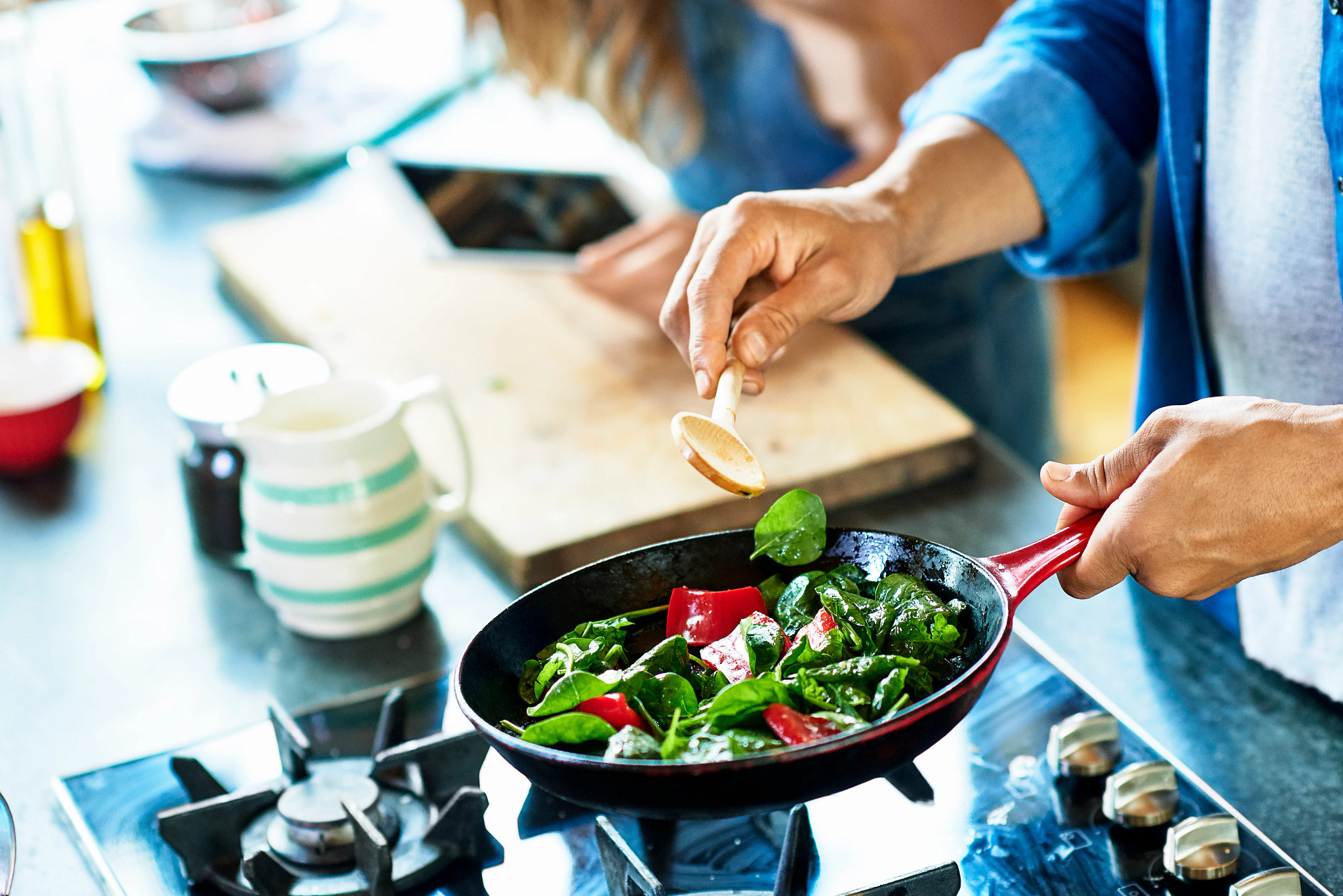 Man frying vegetables