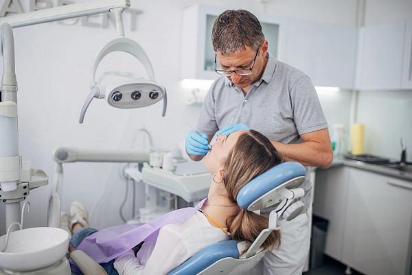 gettyimages-1451155596_young-woman-having-her-teeth-checked.jpg