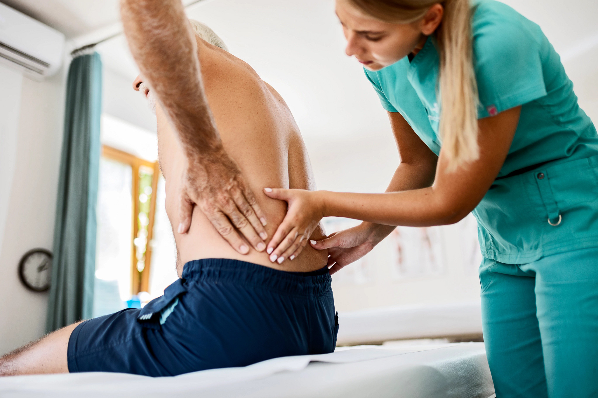 Physiotherapist working on back pain