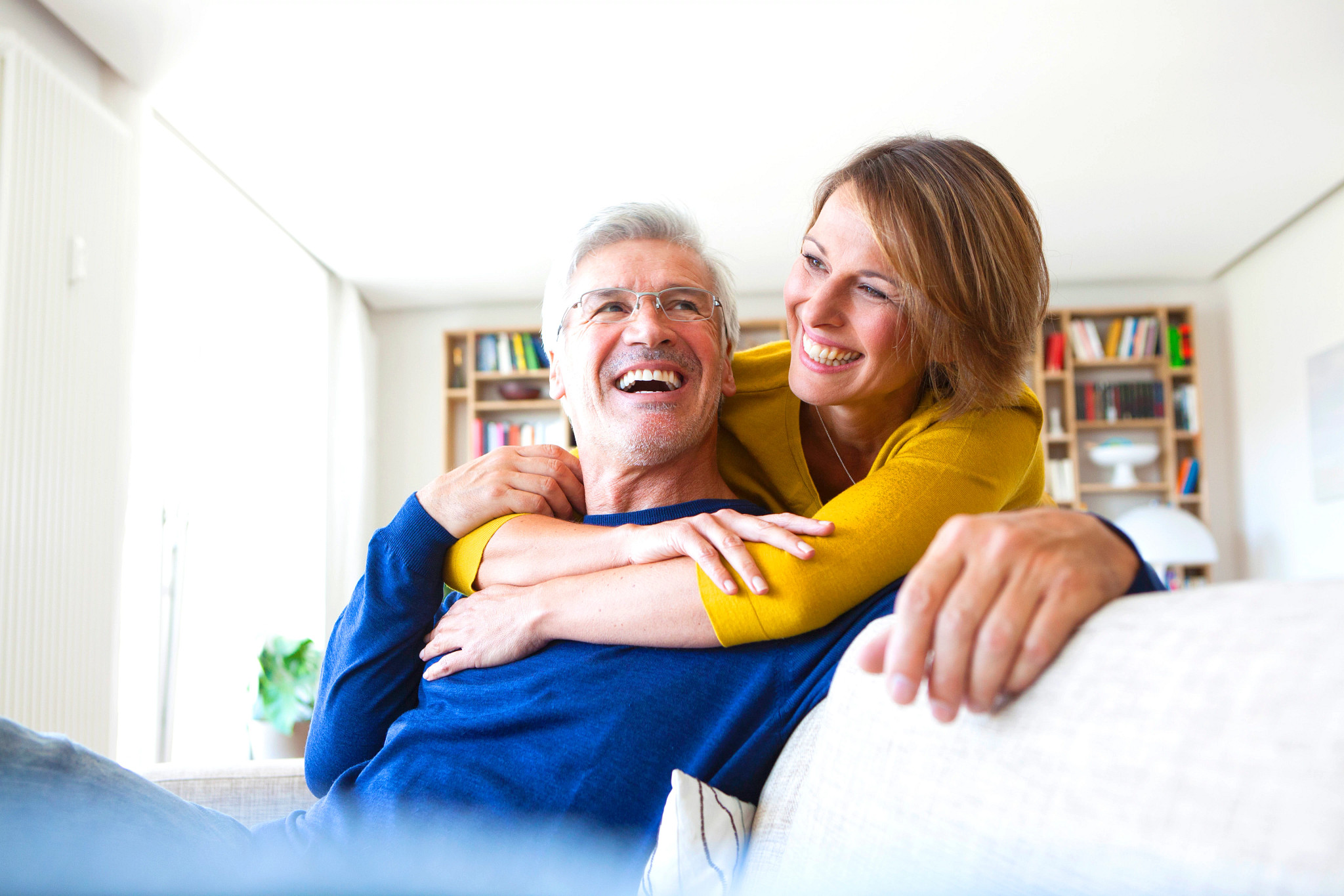 Portrait of laughing couple in the living room