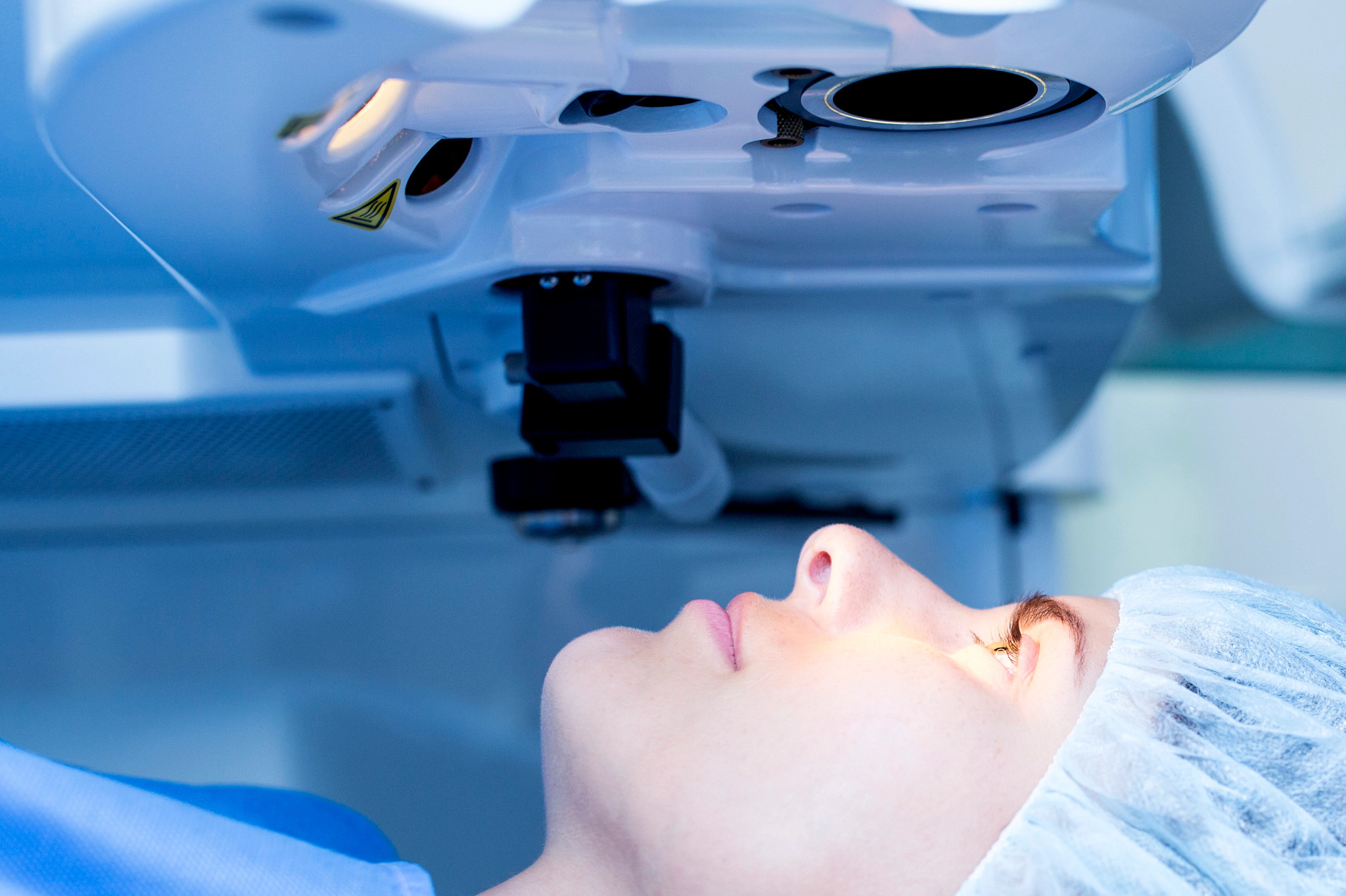 Female patient undergoing laser eye surgery.