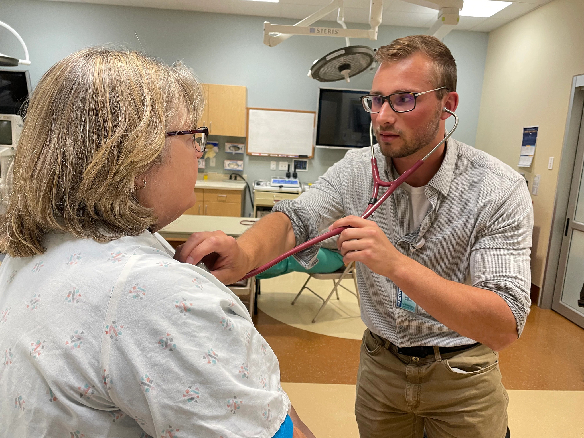 medical-student-listening-to-patients-heart