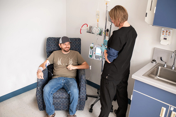 Nurse caring for patient undergoing an infusion.
