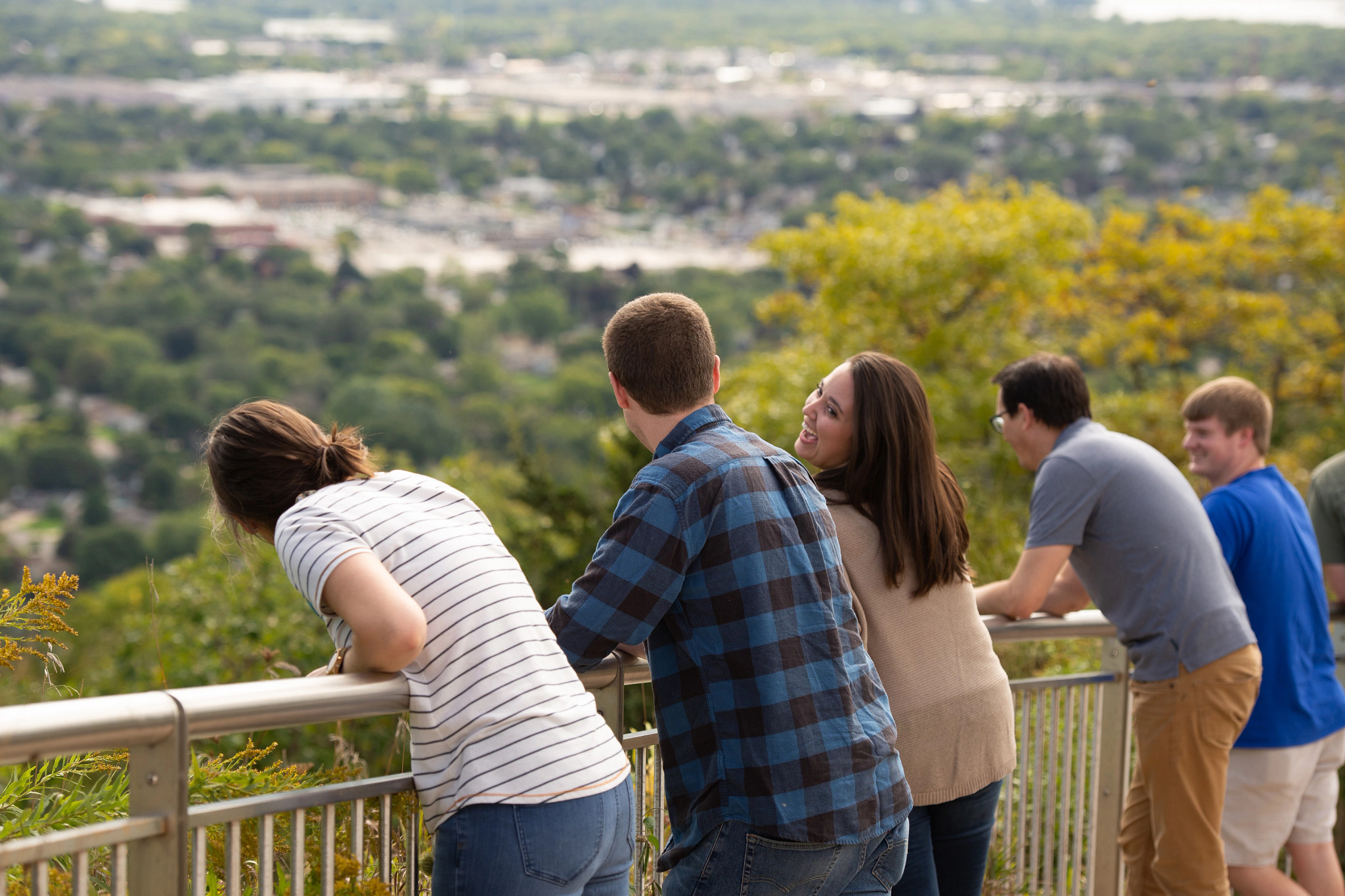 Friends sightseeing from bluff.