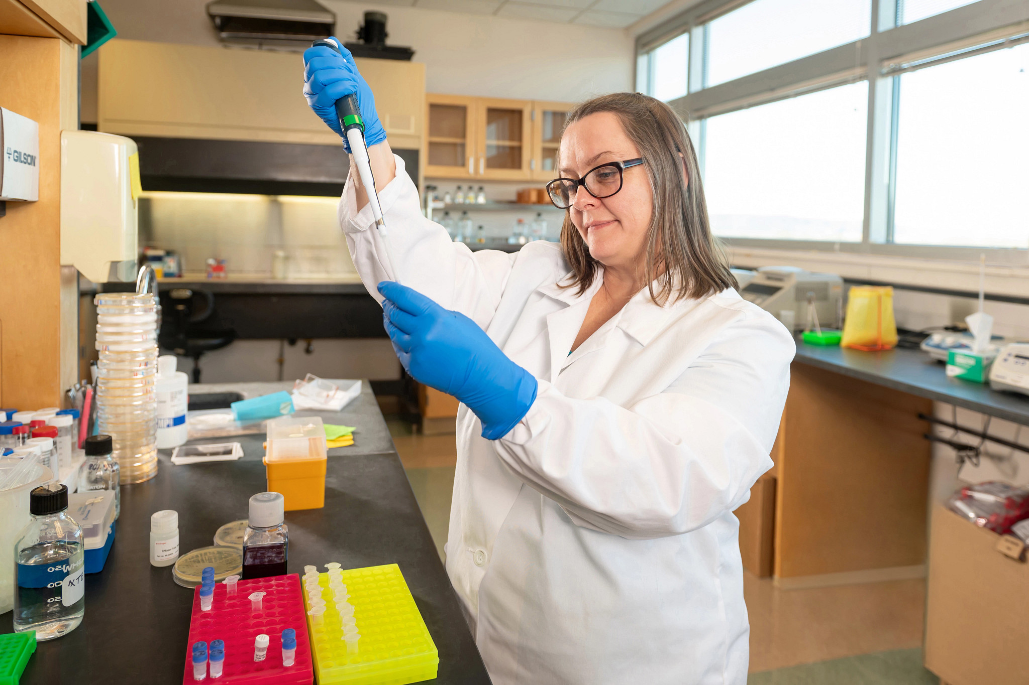 Research scientist darby oldenburg in lab.