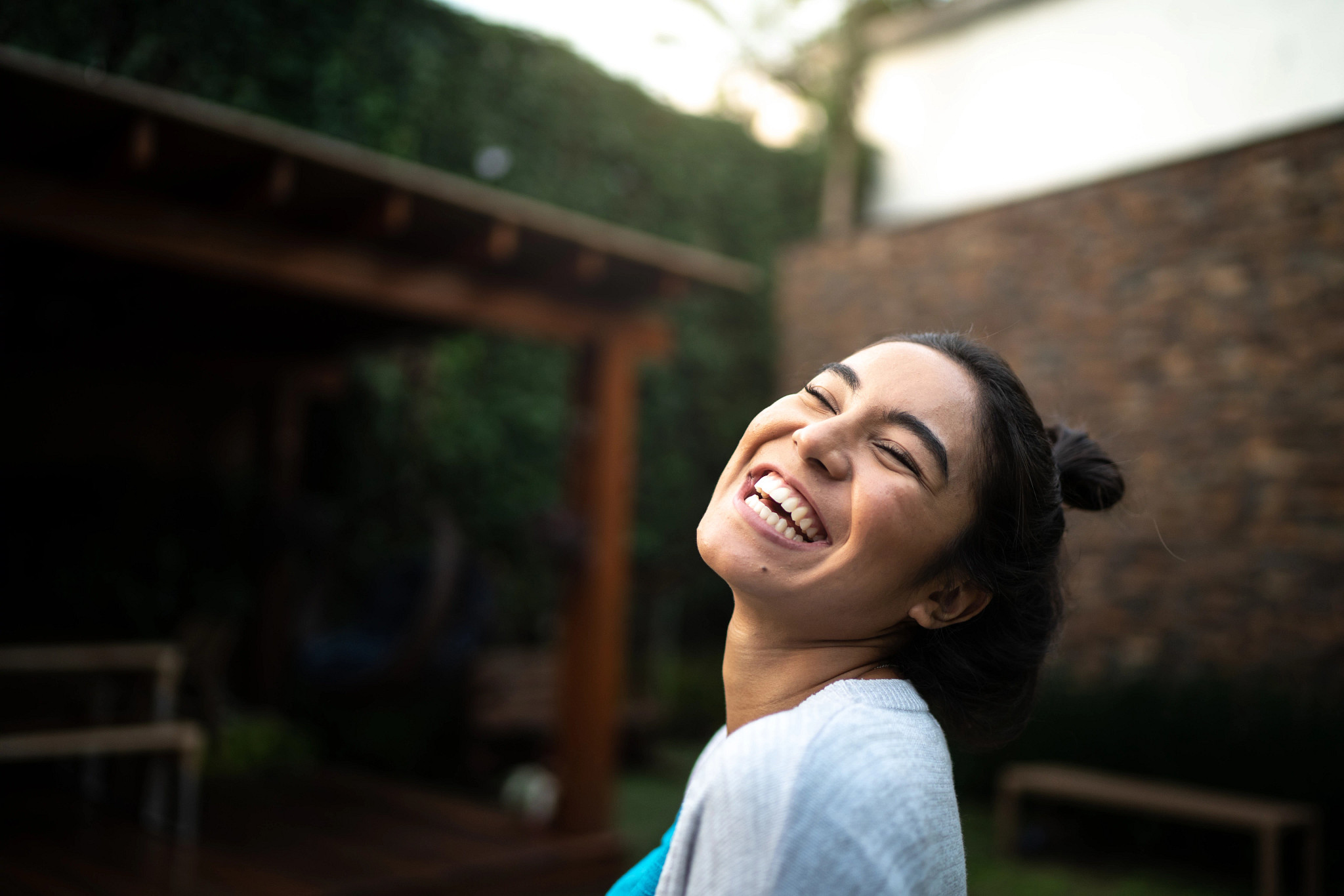 Happy woman laughing at home