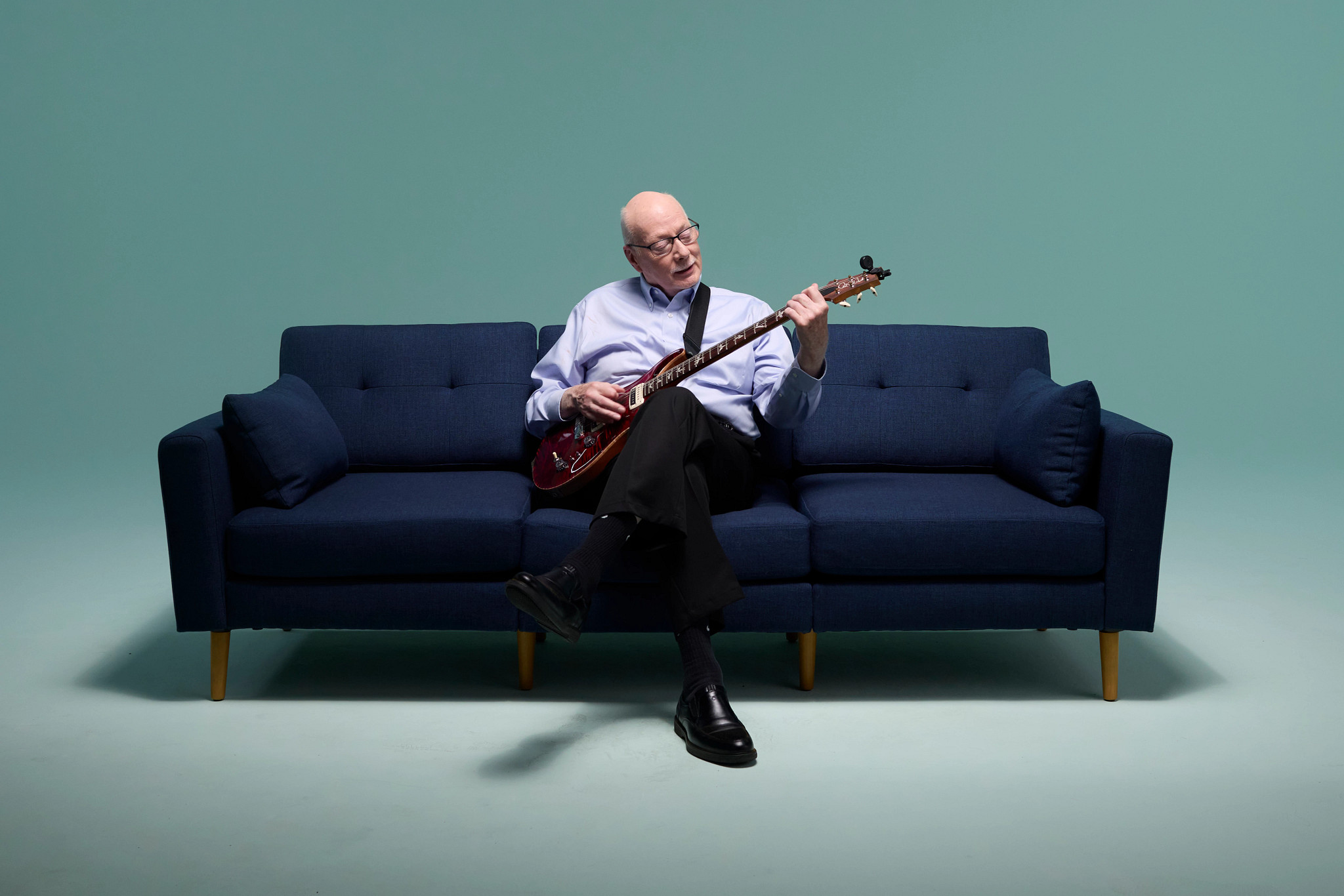 Peter playing his guitar