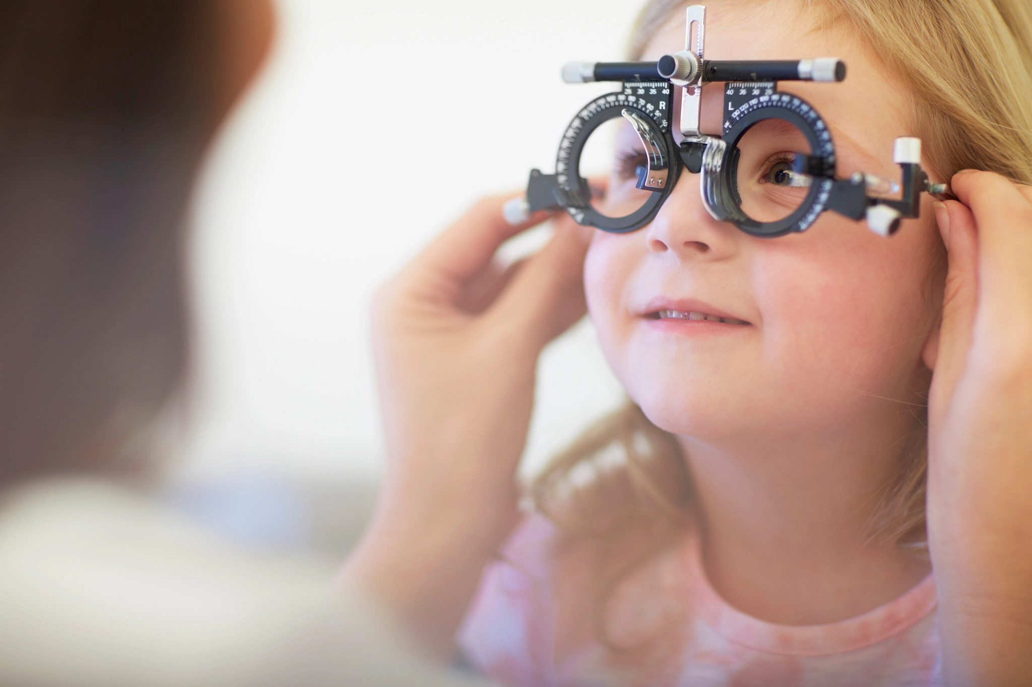 eye-doctor-examining-girls-vision.jpg
