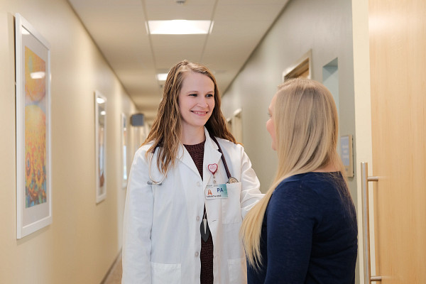 pa-speaking-with-patient-in-hallway.jpg