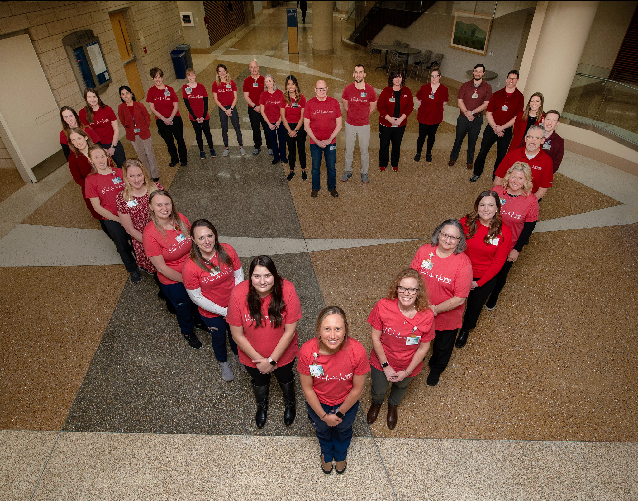 cardiology-team-forms-large-heart-in-hospital.jpg