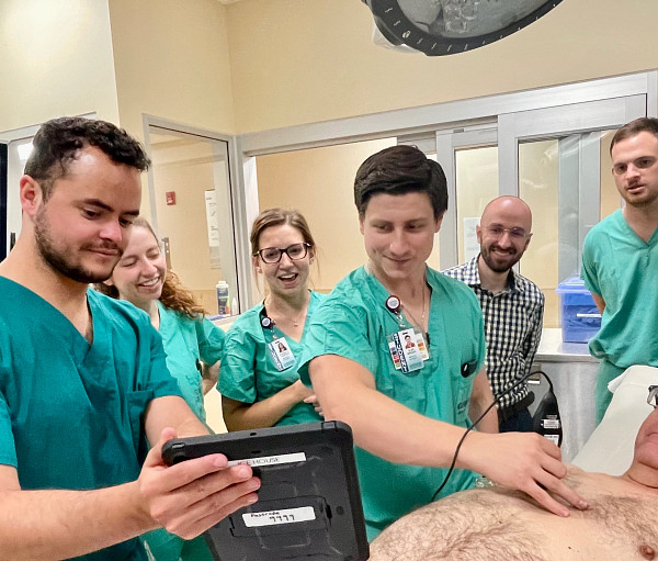 Medical students training with a patient