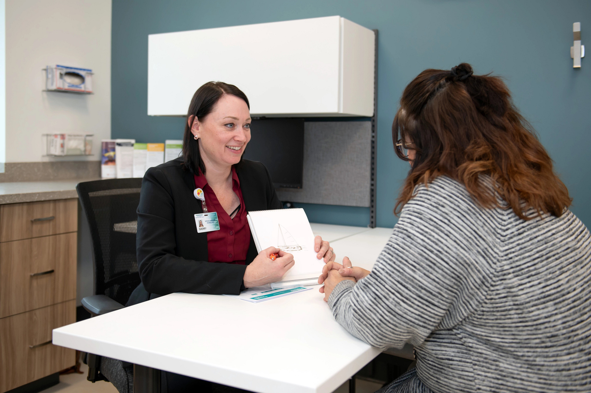 Gundersen Tri-County speech therapist working with adult patient.