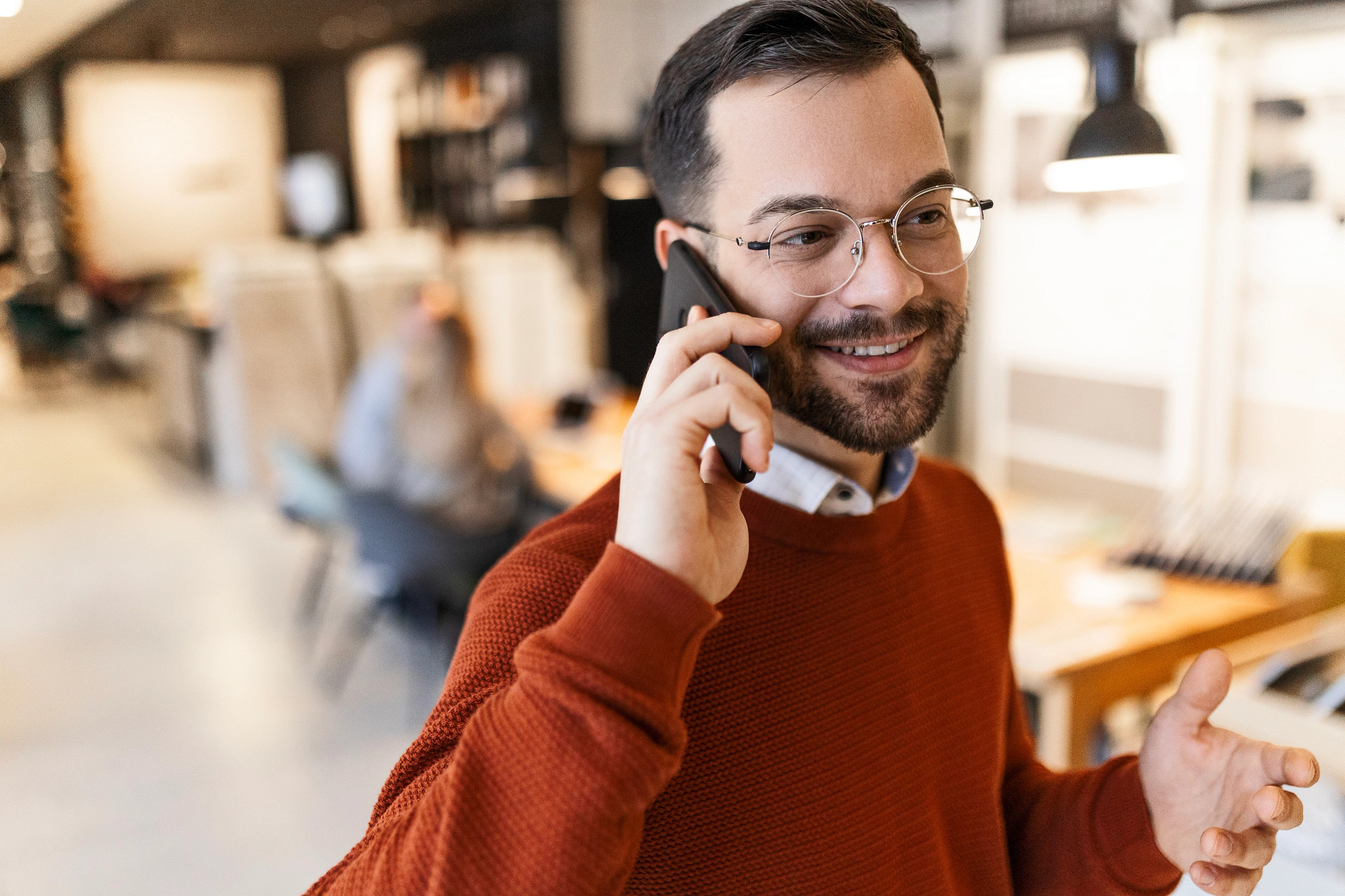 Smiling patient using a smart phone