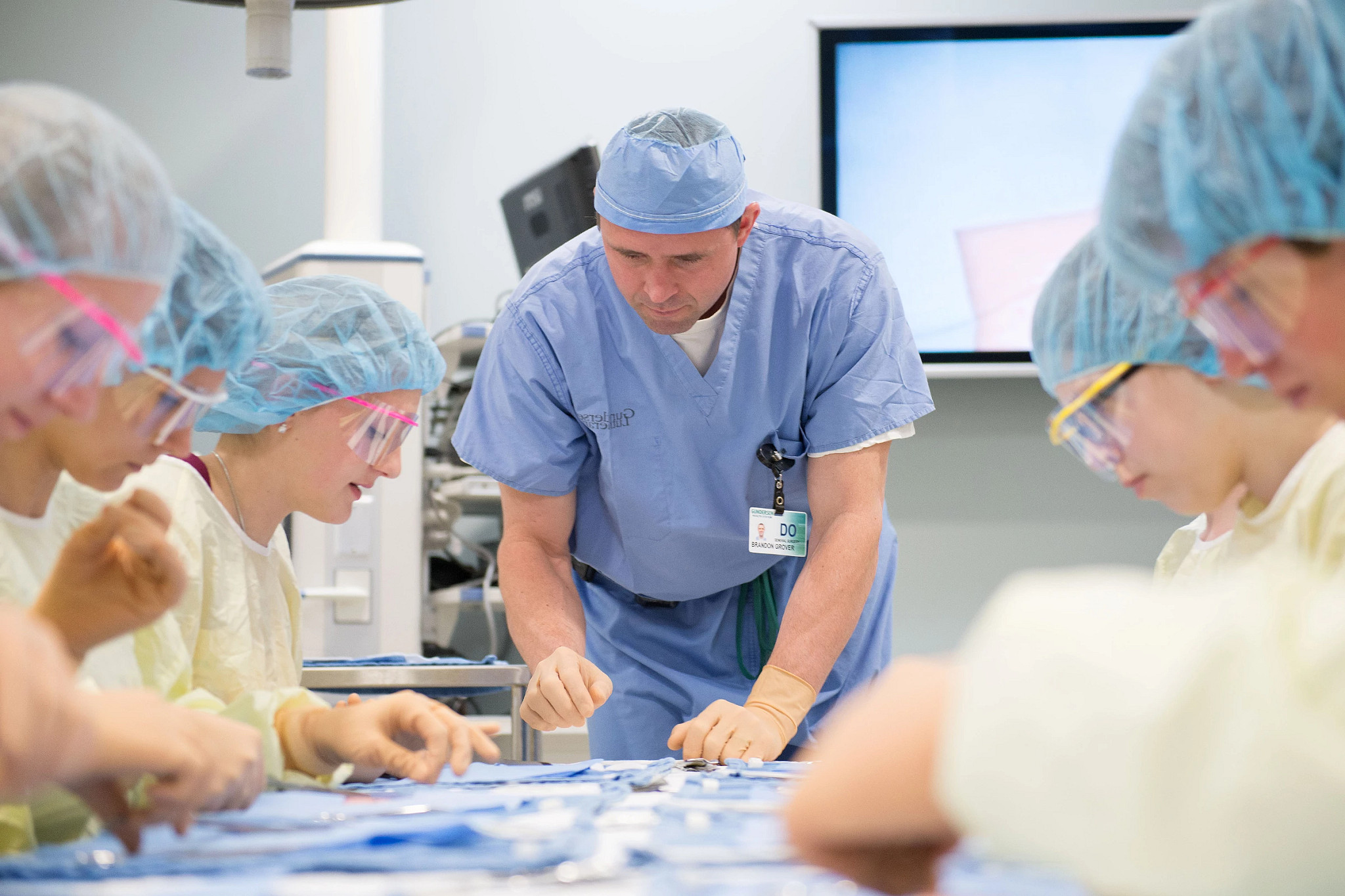 Bariatric surgeon teaching fellows in skills lab.