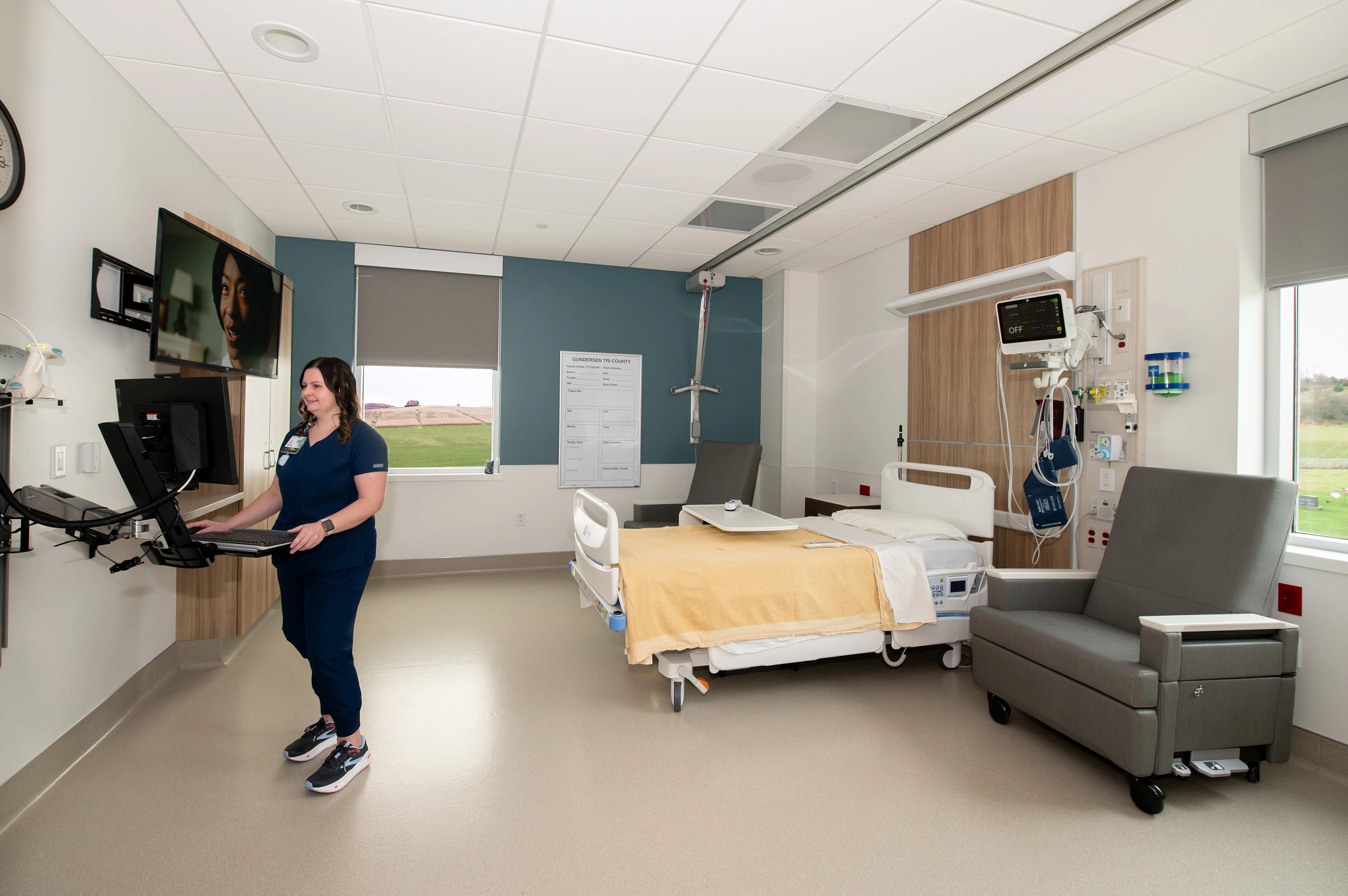 Gundersen Tri-County nurse on workstation in a swing bed hospital room.