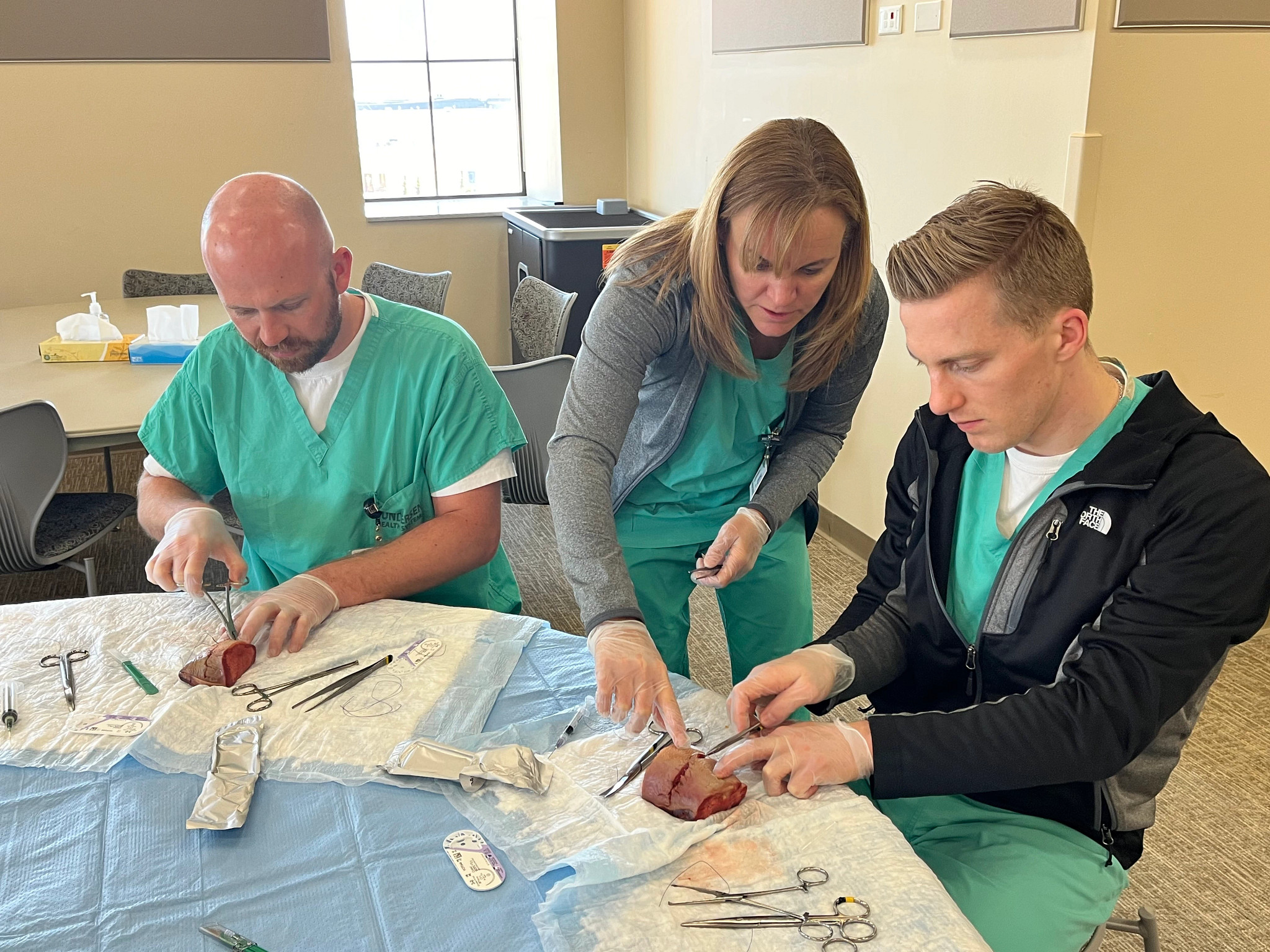 Family medicine obstetrics residents training with doctor.