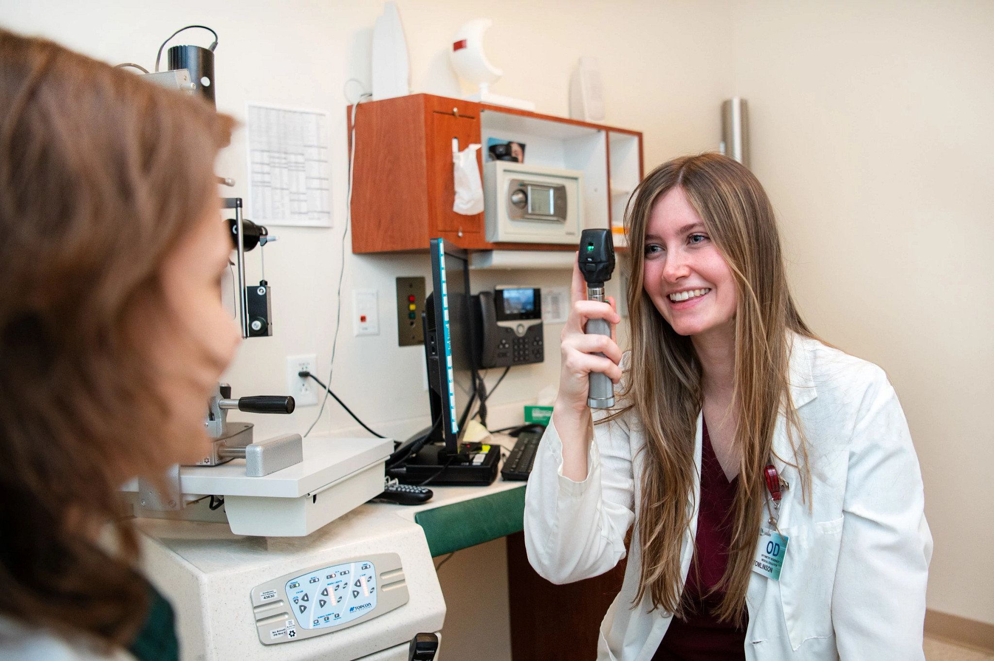 optometrist-giving-patient-exam