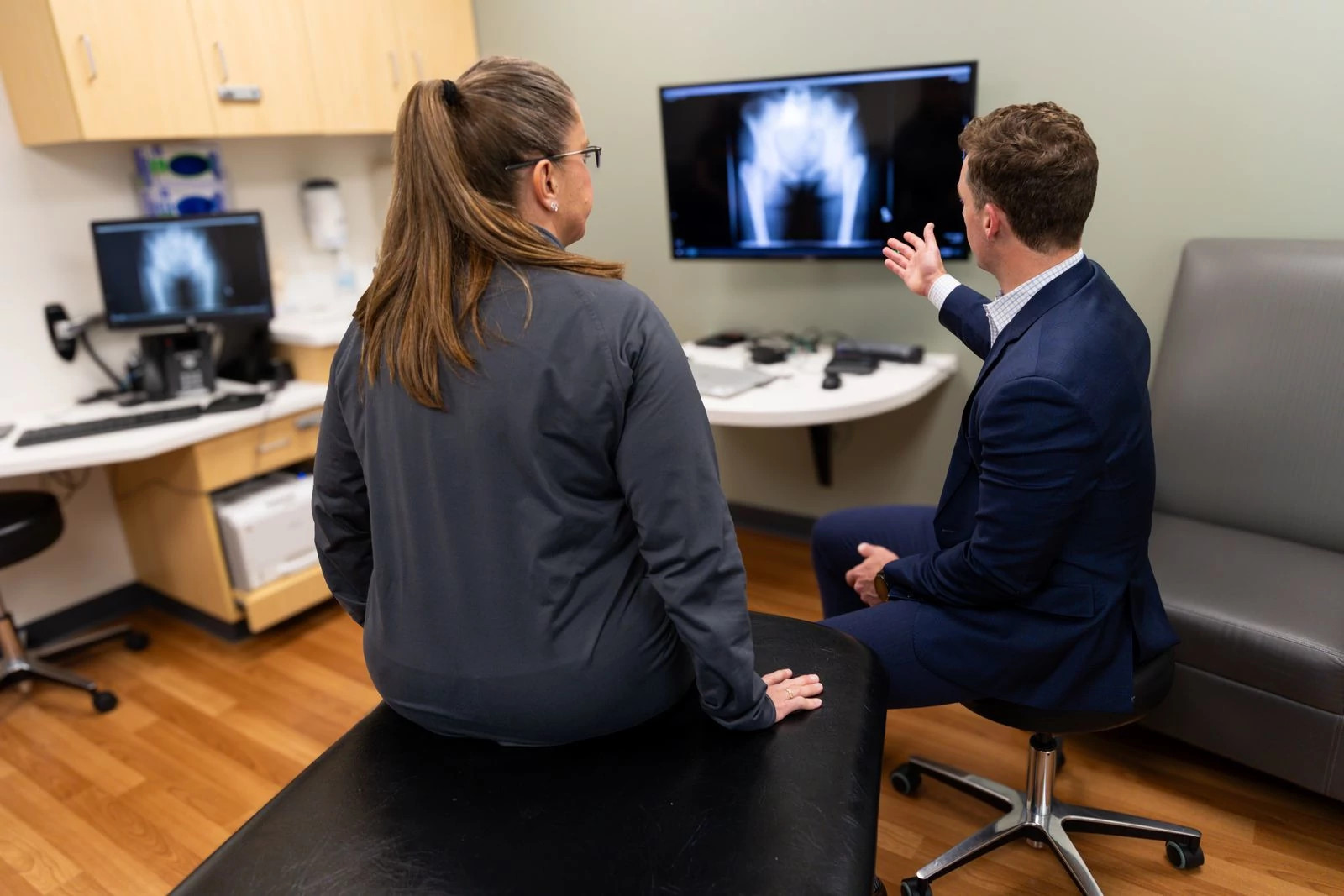 Patient reviewing imaging during a hip preservation appointment to assess candidacy for hip preservation surgery, guided by Dr. Michael Ryan, MD.