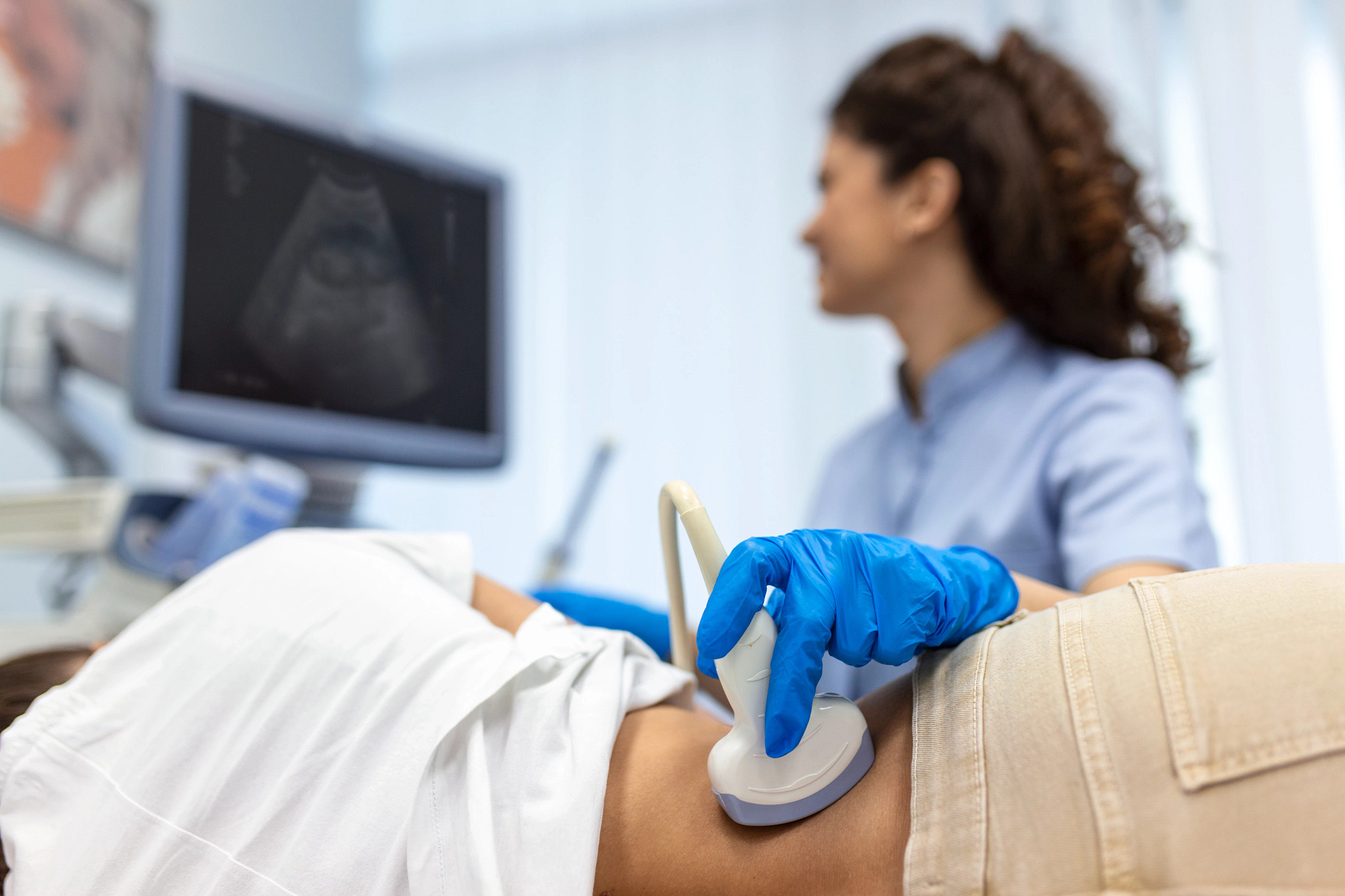 Doctor conducts ultrasound examination