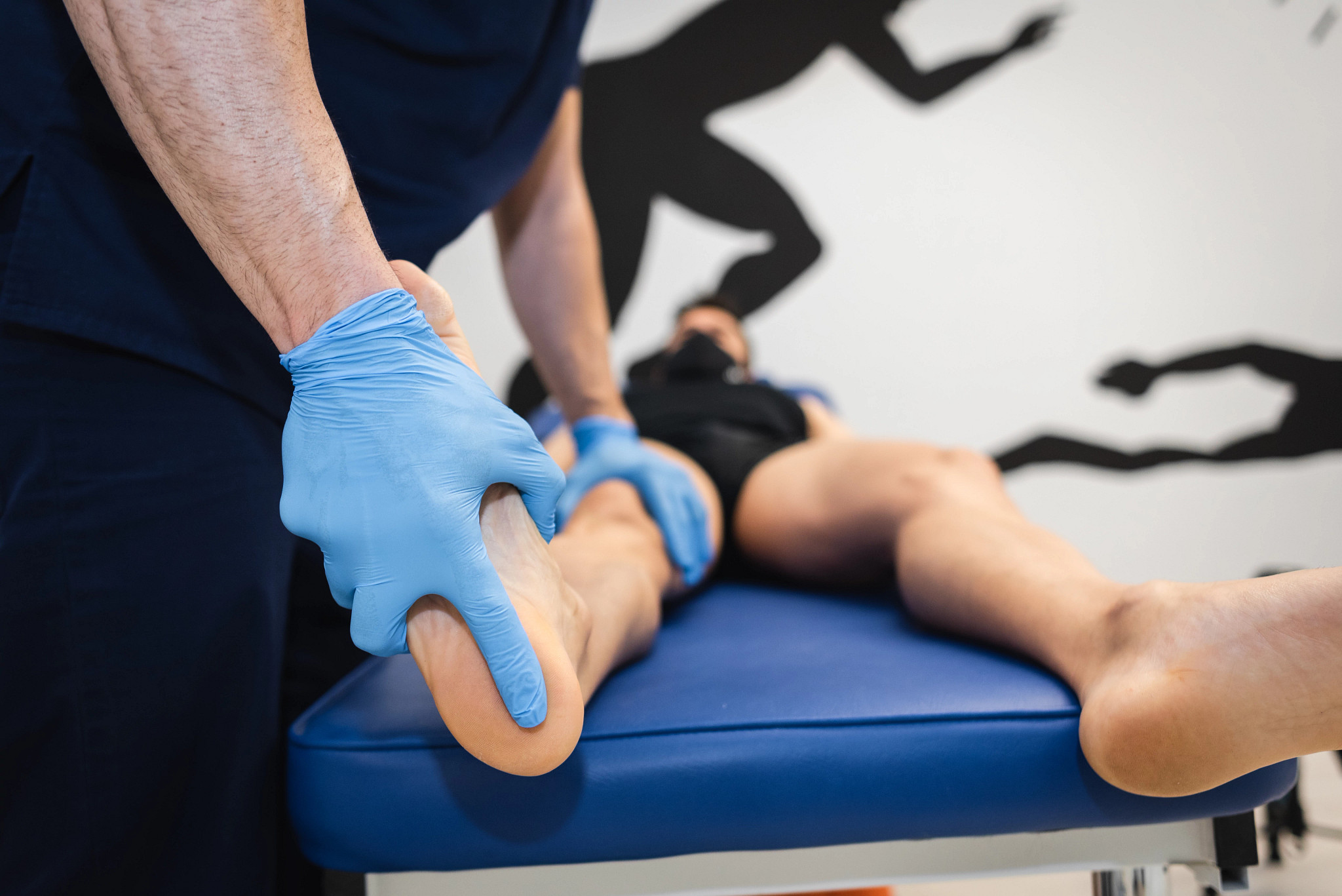 Podiatrist checking the foot of a patient