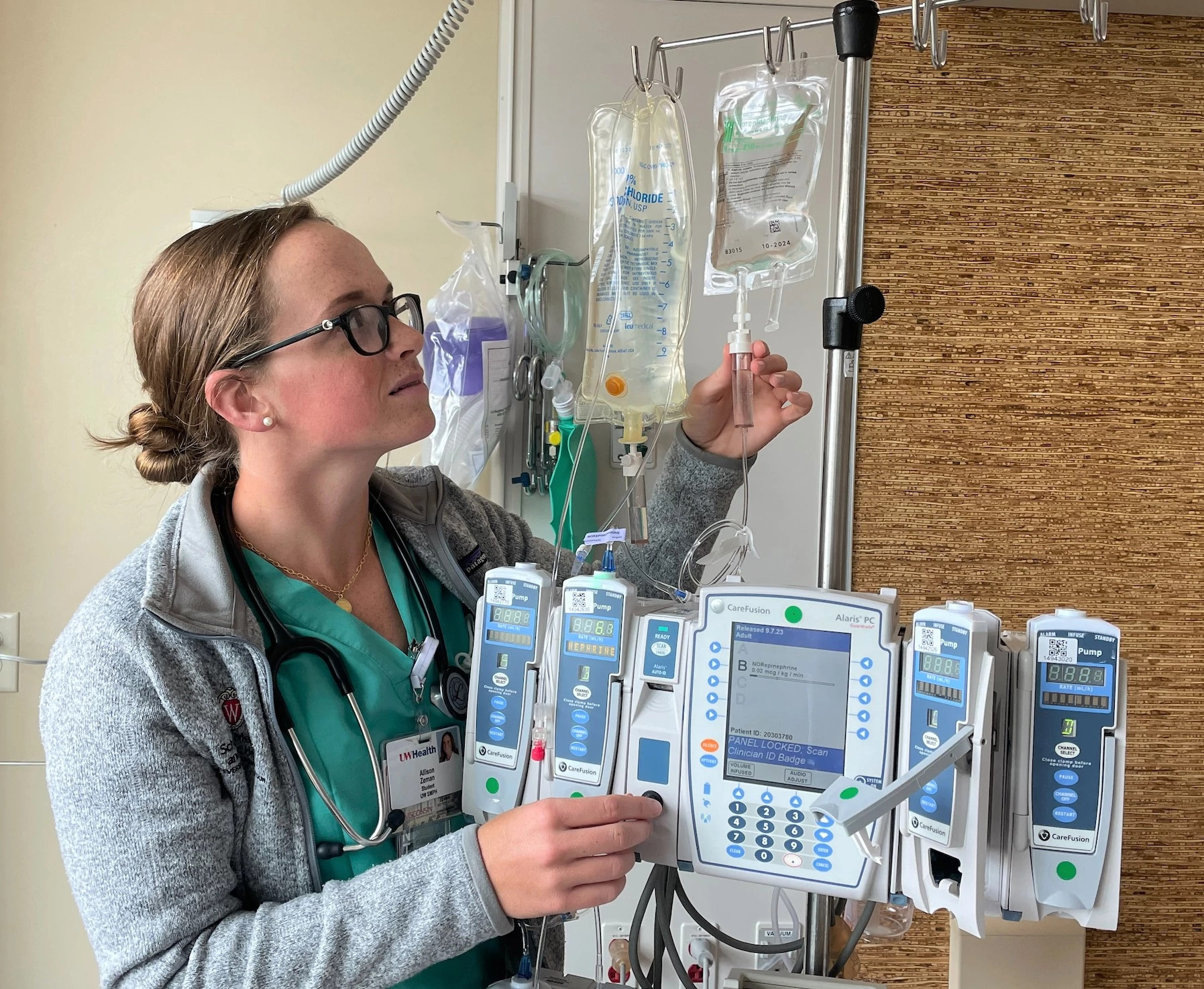 medical-student-managing-IVs-in-intensive-care-unit