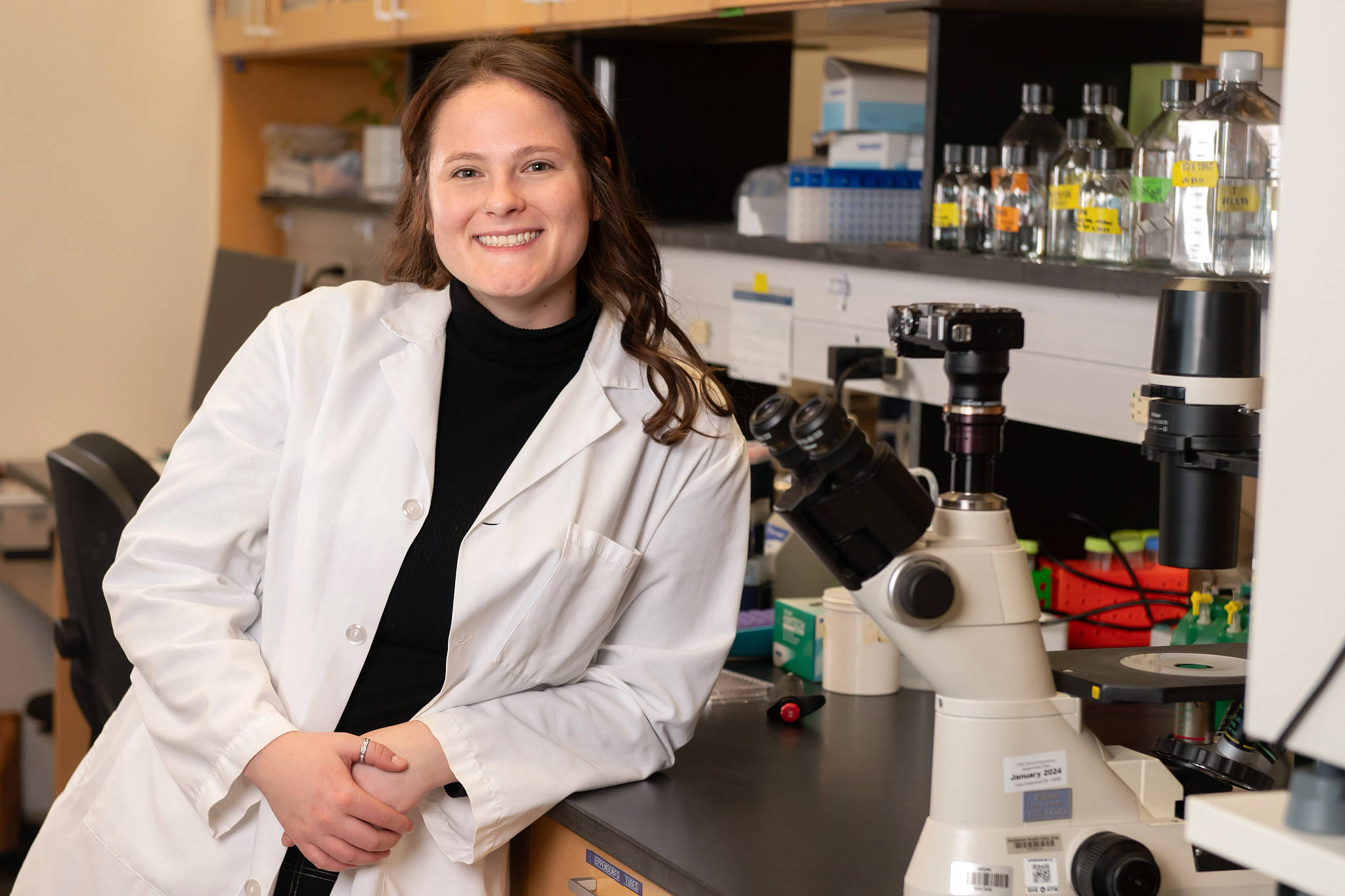 Cleo Haugen ovarian cancer research technician smiling in lab.