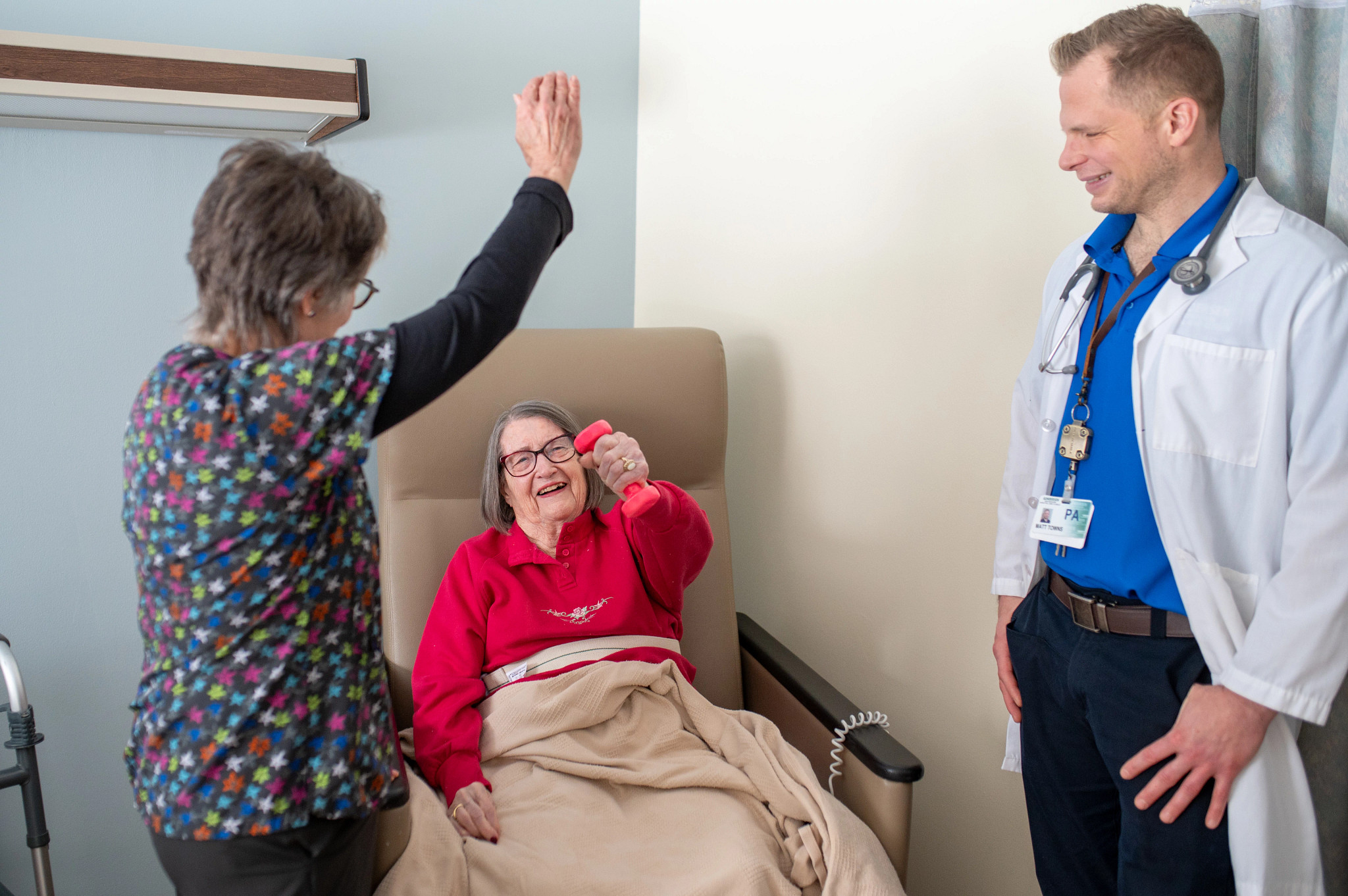 Gundersen swing bed patient with physical therapist and PA.